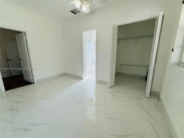 an empty room with a bathroom