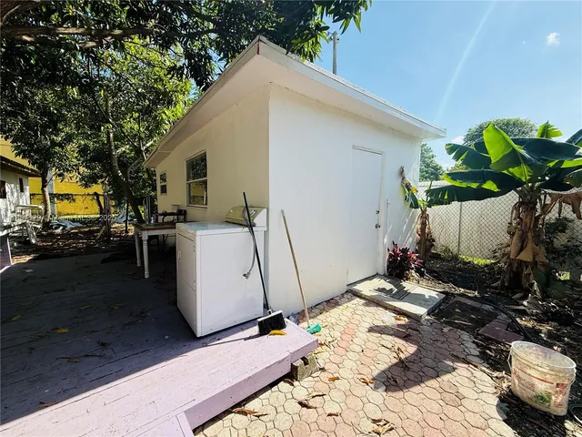 a room with a bed and a window