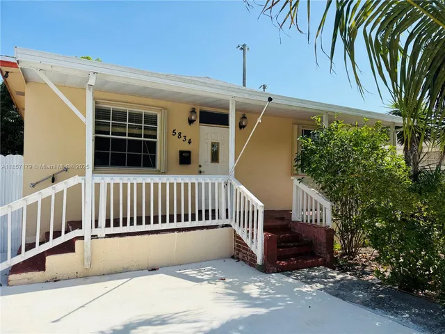 a view of balcony with furniture