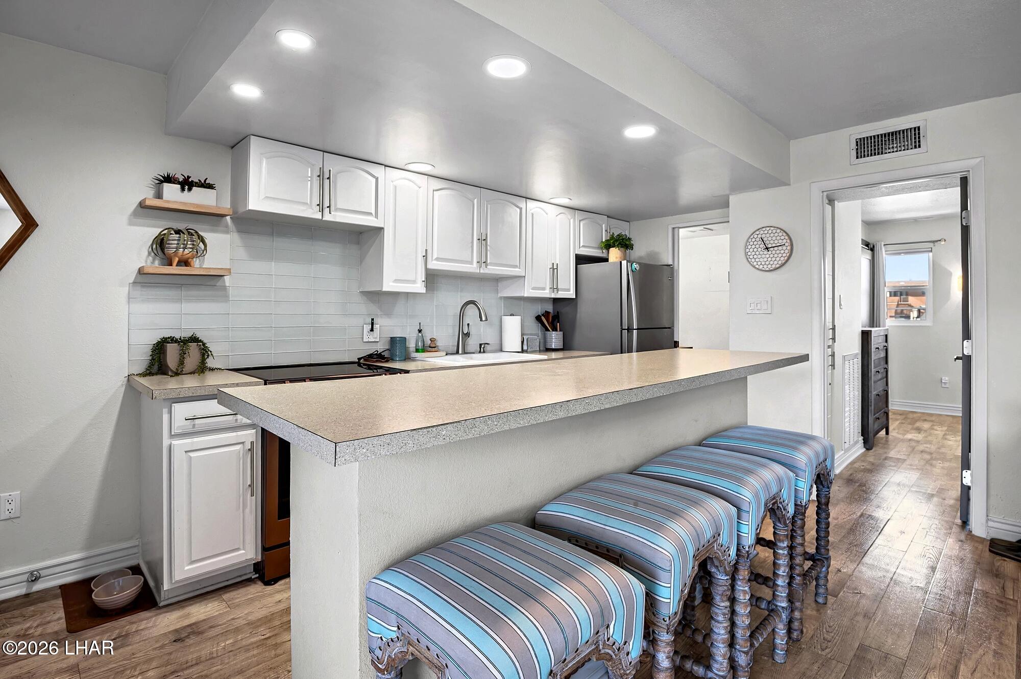 9170 Riverside Drive, Unit 13 Parker, AZ 85344 - Photo 12 of 51 a kitchen with stainless steel appliances granite countertop a sink and cabinets