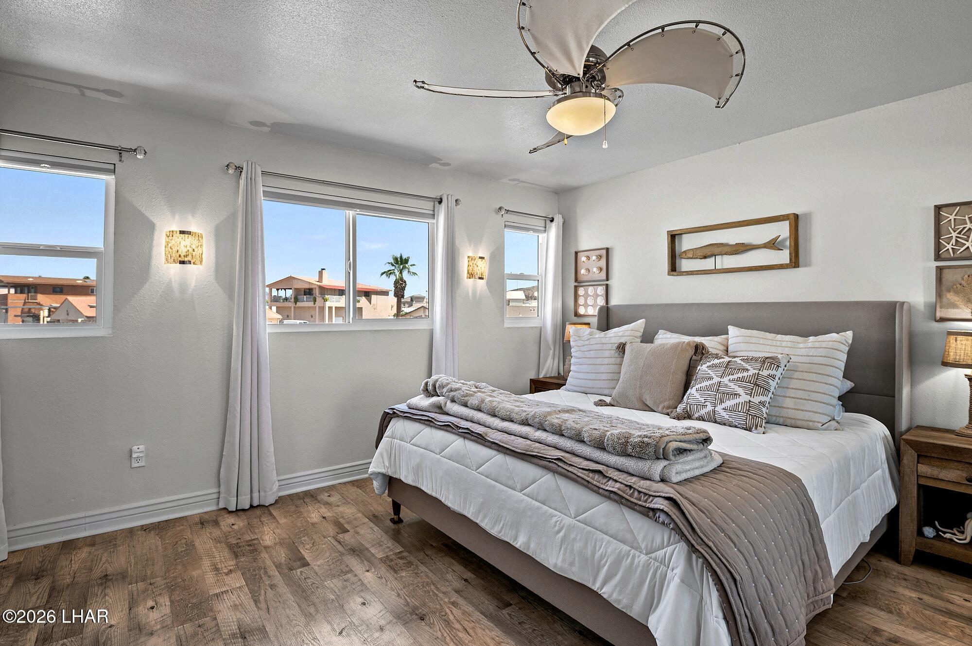 9170 Riverside Drive, Unit 13 Parker, AZ 85344 - Photo 26 of 51 a bedroom with bed and window