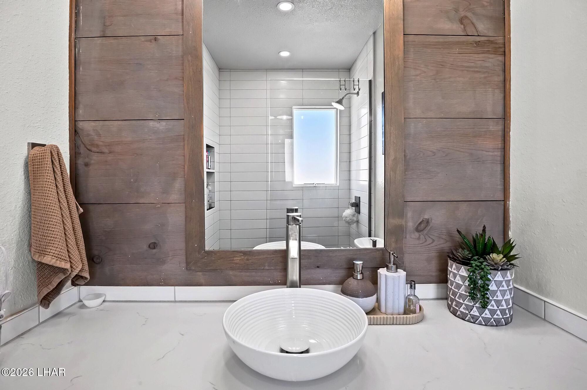 9170 Riverside Drive, Unit 13 Parker, AZ 85344 - Photo 28 of 51 a bathroom with a toilet and a shower