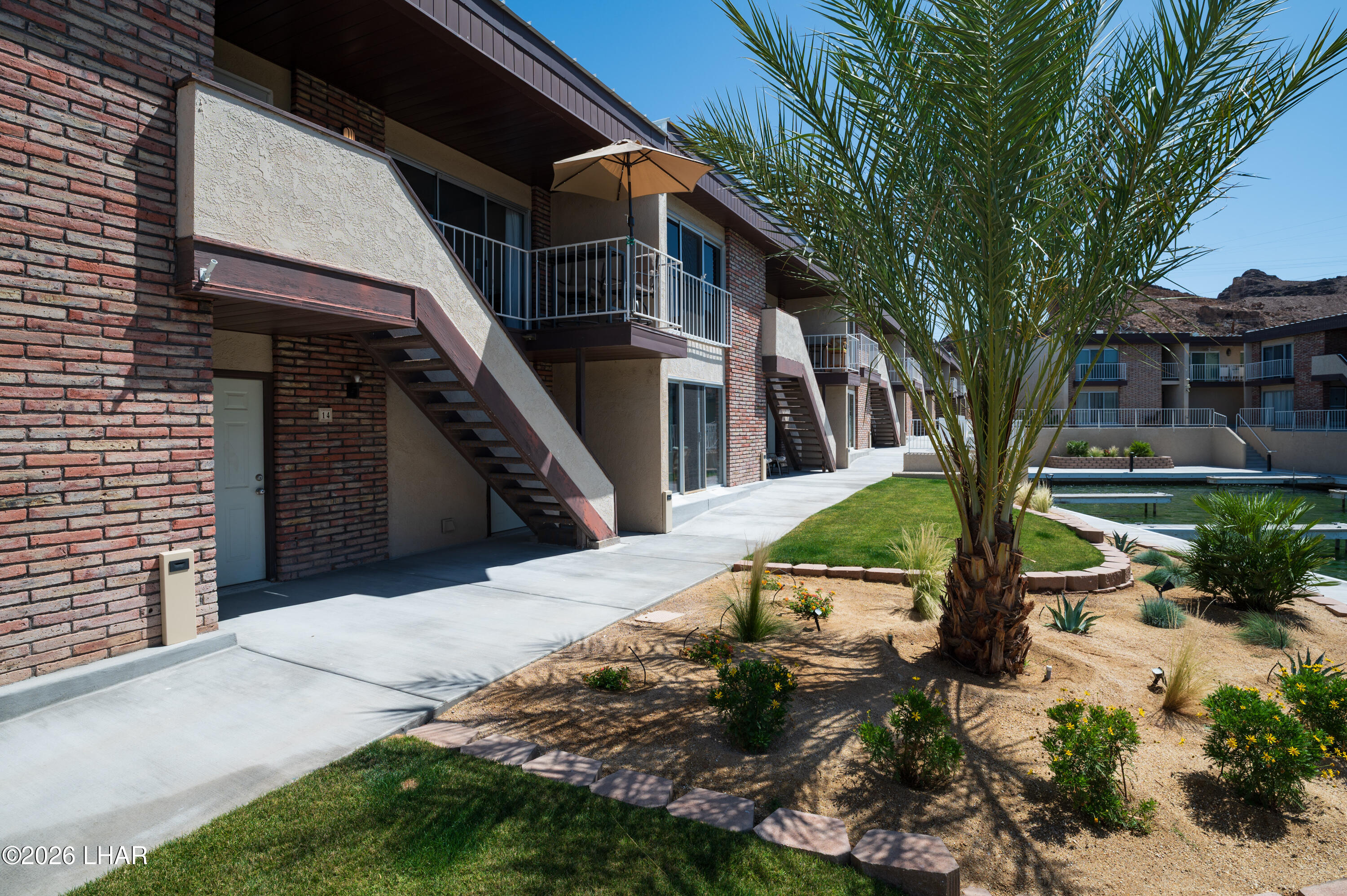 9170 Riverside Drive, Unit 13 Parker, AZ 85344 - Photo 36 of 51 a house with trees in front of it