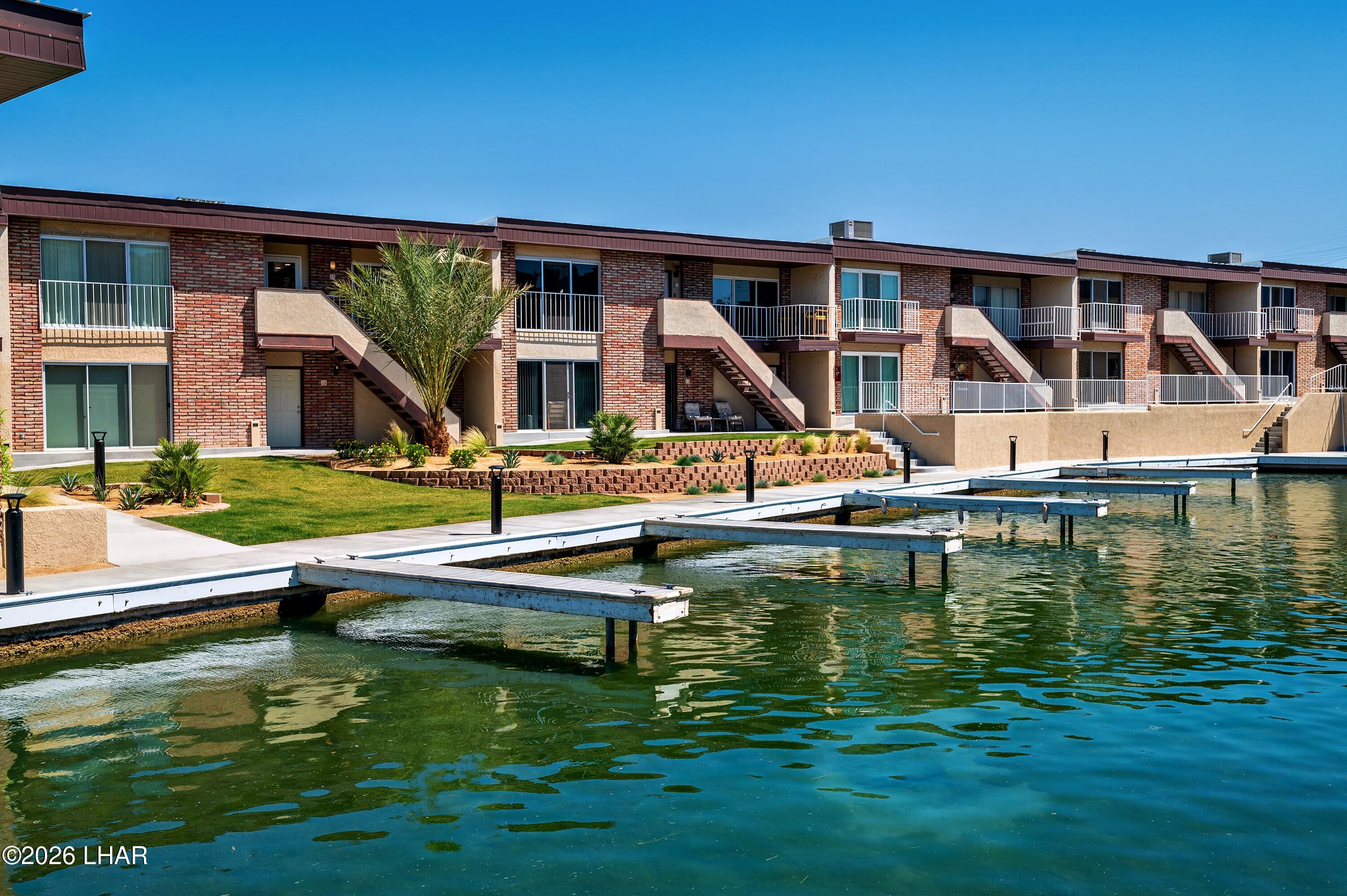 9170 Riverside Drive, Unit 13 Parker, AZ 85344 - Photo 41 of 51 a view of house with swimming pool yard and outdoor seating