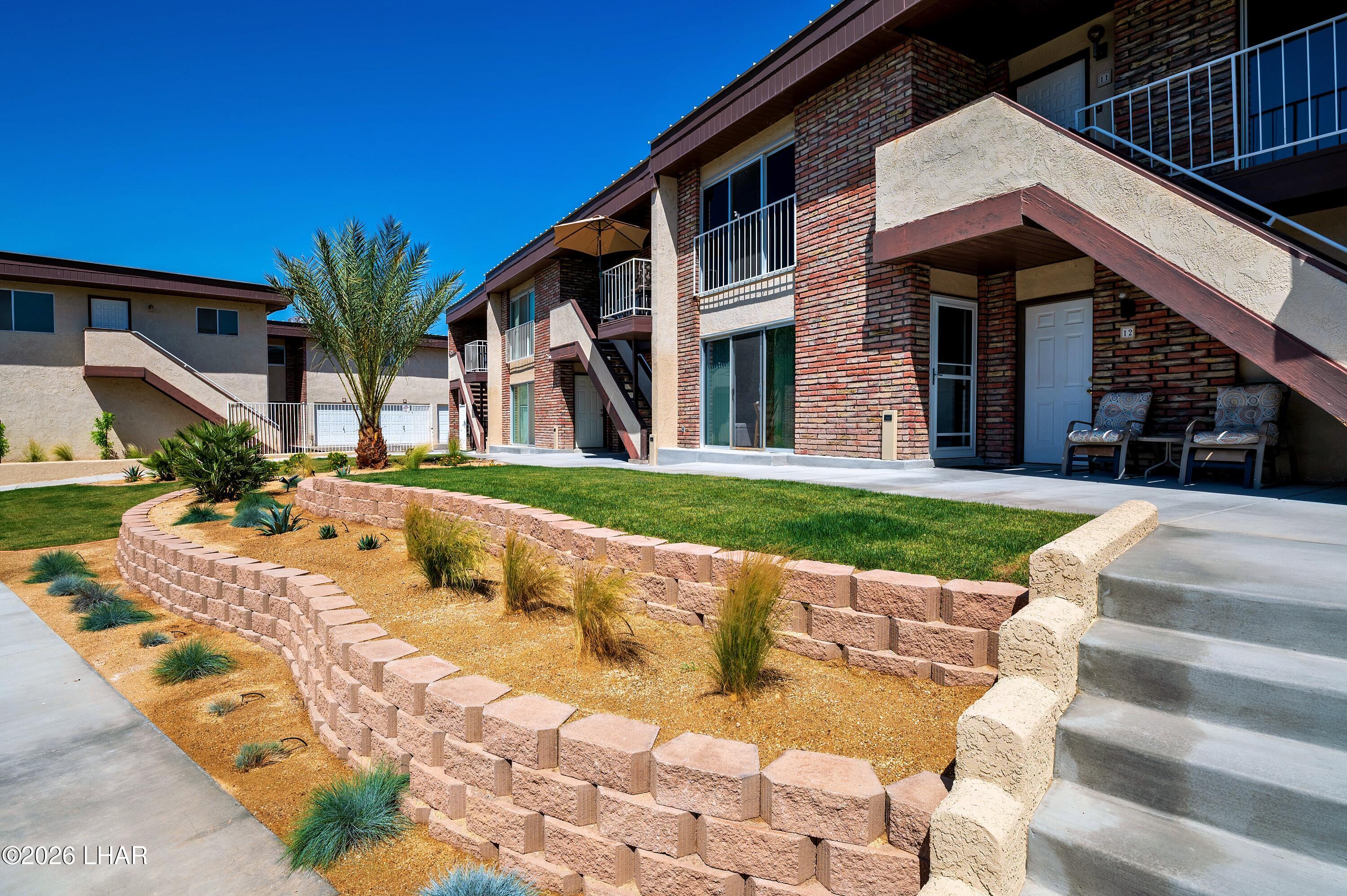 9170 Riverside Drive, Unit 13 Parker, AZ 85344 - Photo 44 of 51 a view of a house with swimming pool and porch with furniture