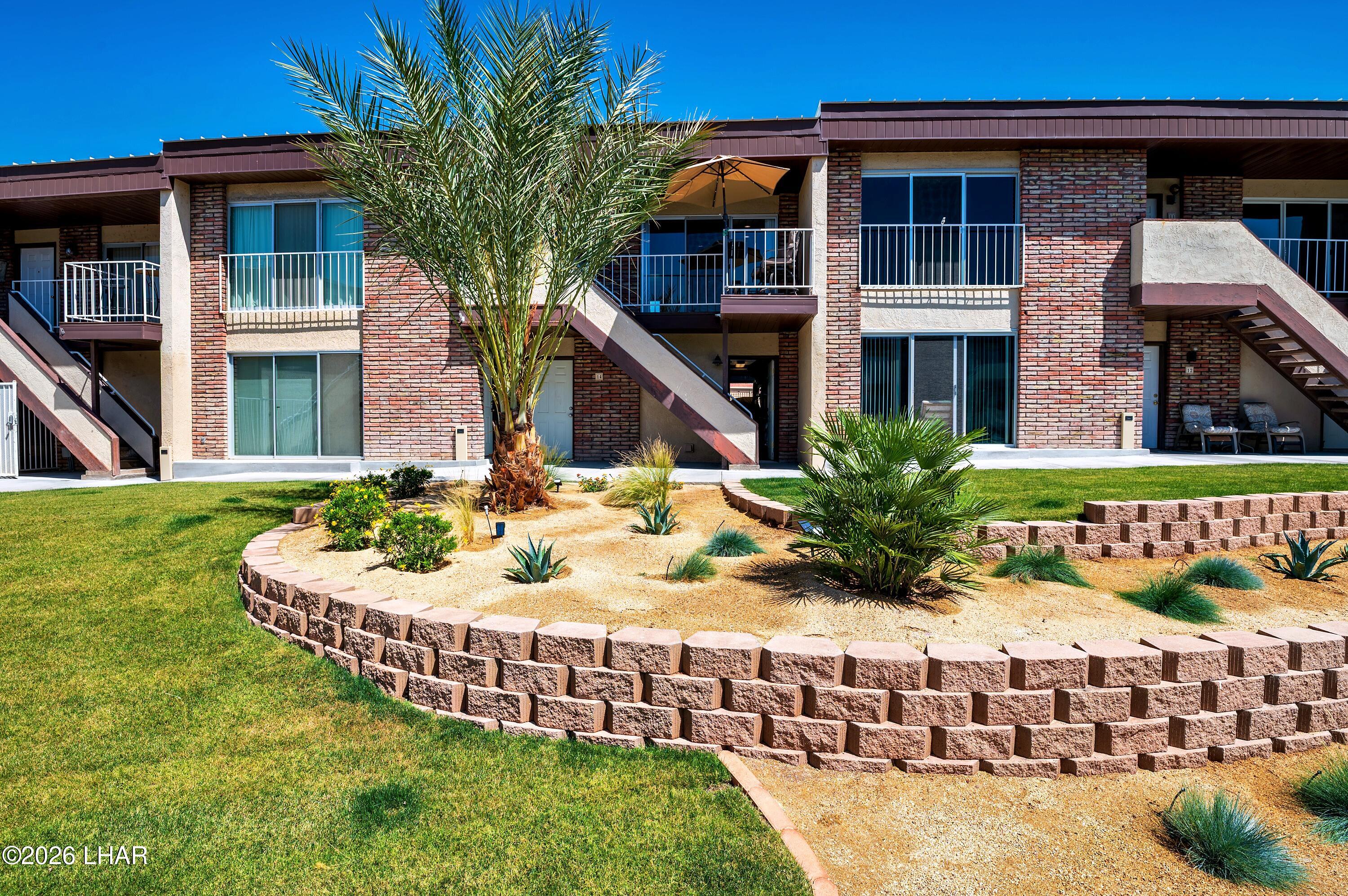 9170 Riverside Drive, Unit 13 Parker, AZ 85344 - Photo 45 of 51 a front view of house with yard