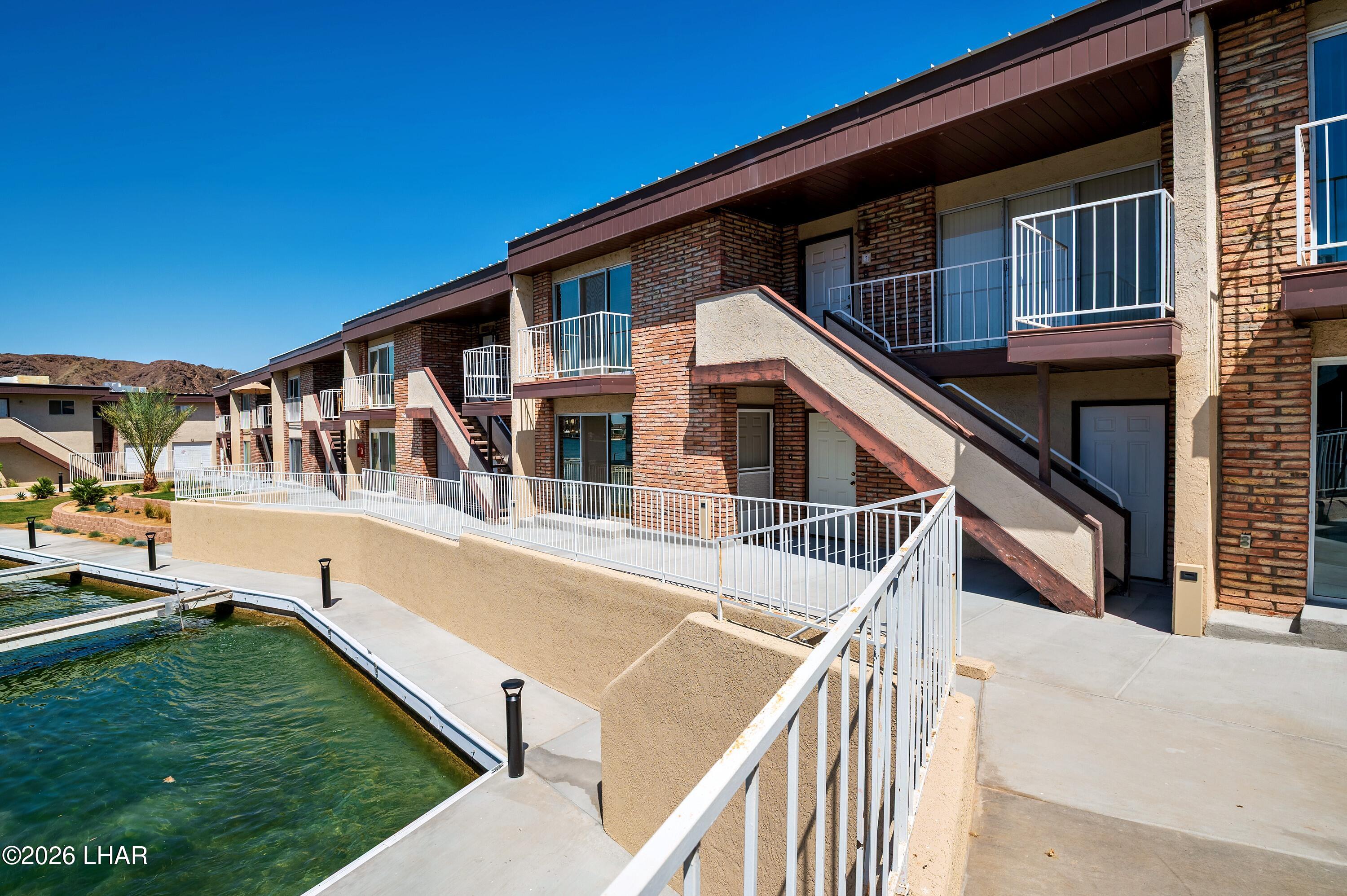 9170 Riverside Drive, Unit 13 Parker, AZ 85344 - Photo 51 of 51 a view of house with swimming pool and deck
