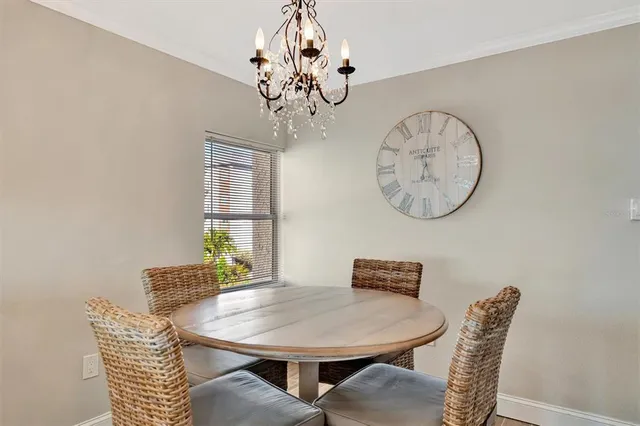 a living room with furniture a flat screen tv and a large window