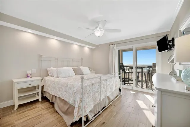 a large white bed in a white room