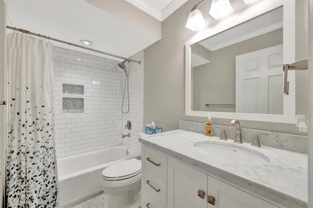 a bathroom with a sink toilet a mirror and shower