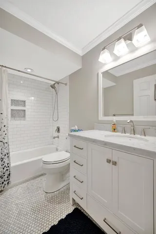 a bathroom with a bath tub a shower and a sink