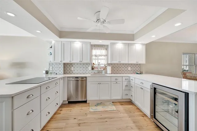 a kitchen with granite countertop a sink and cabinets
