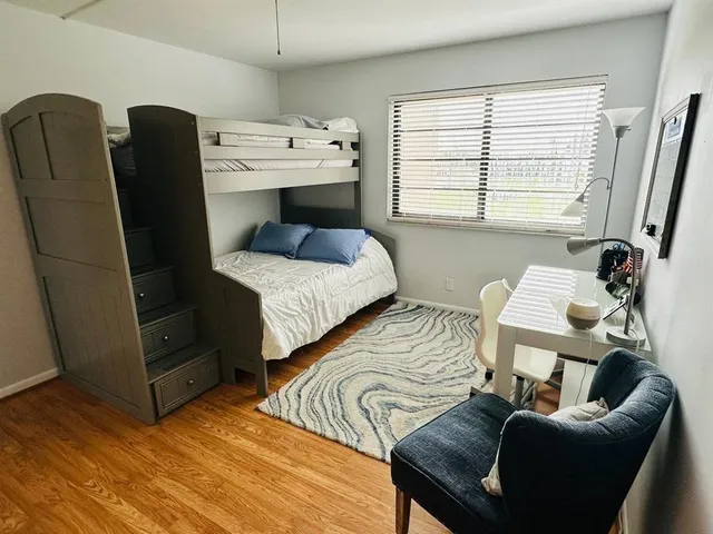 a bedroom with furniture and a window