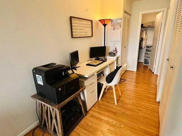a view of a workspace with furniture