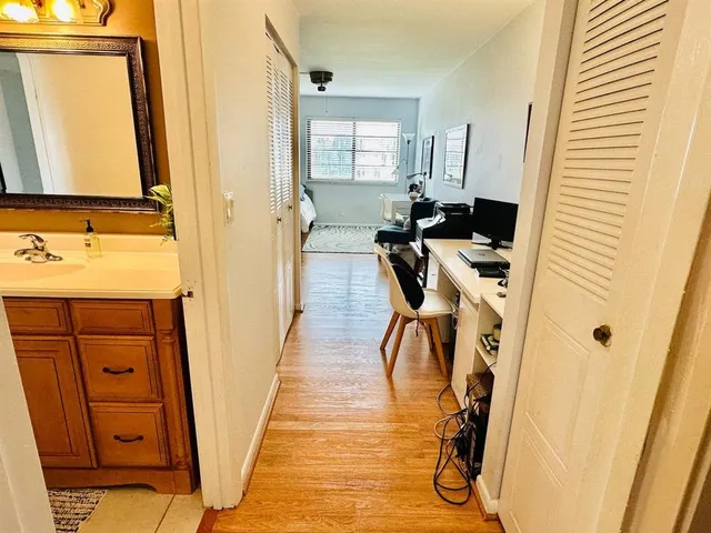 a view of a bathroom with a sink and mirror