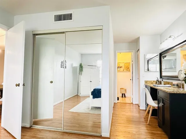 a living room with stainless steel appliances granite countertop furniture and a table
