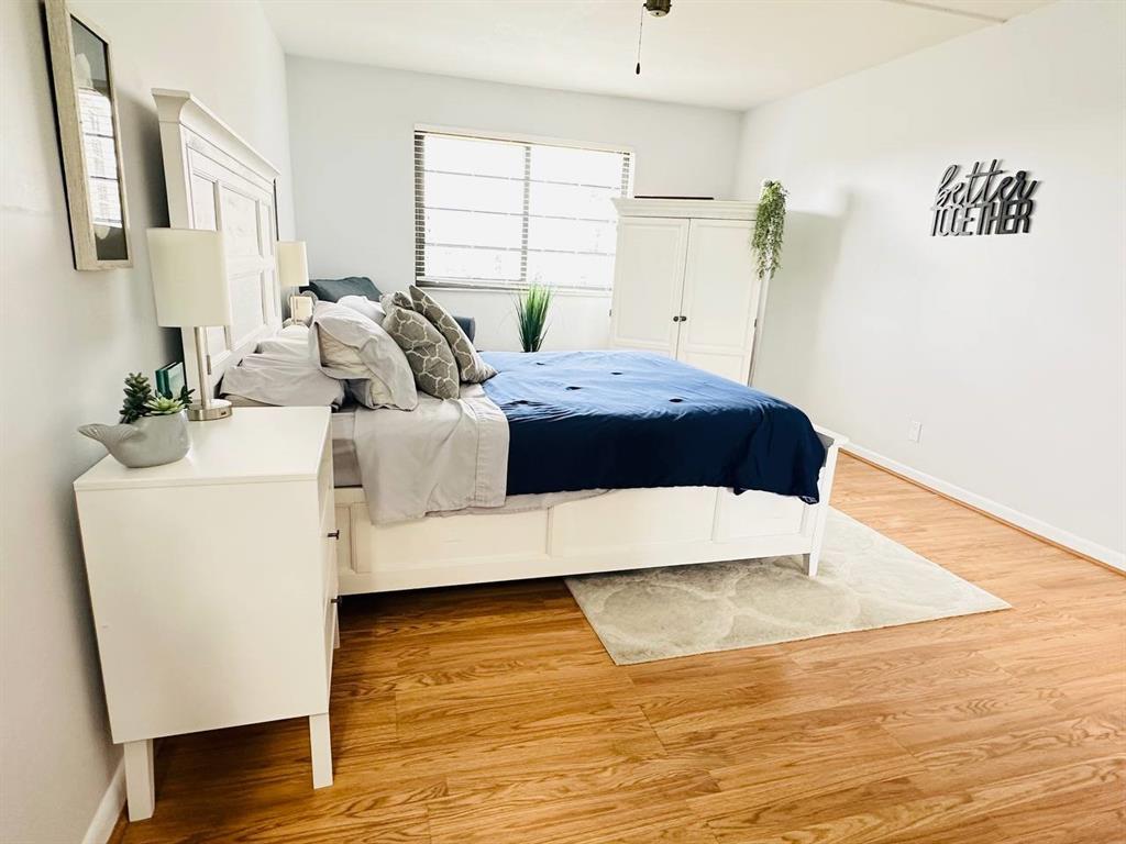 9300 Southwest 8th Street, Unit 214 Boca Raton, FL 33428 - Photo 25 of 32 a large bed sitting in a room next to a window