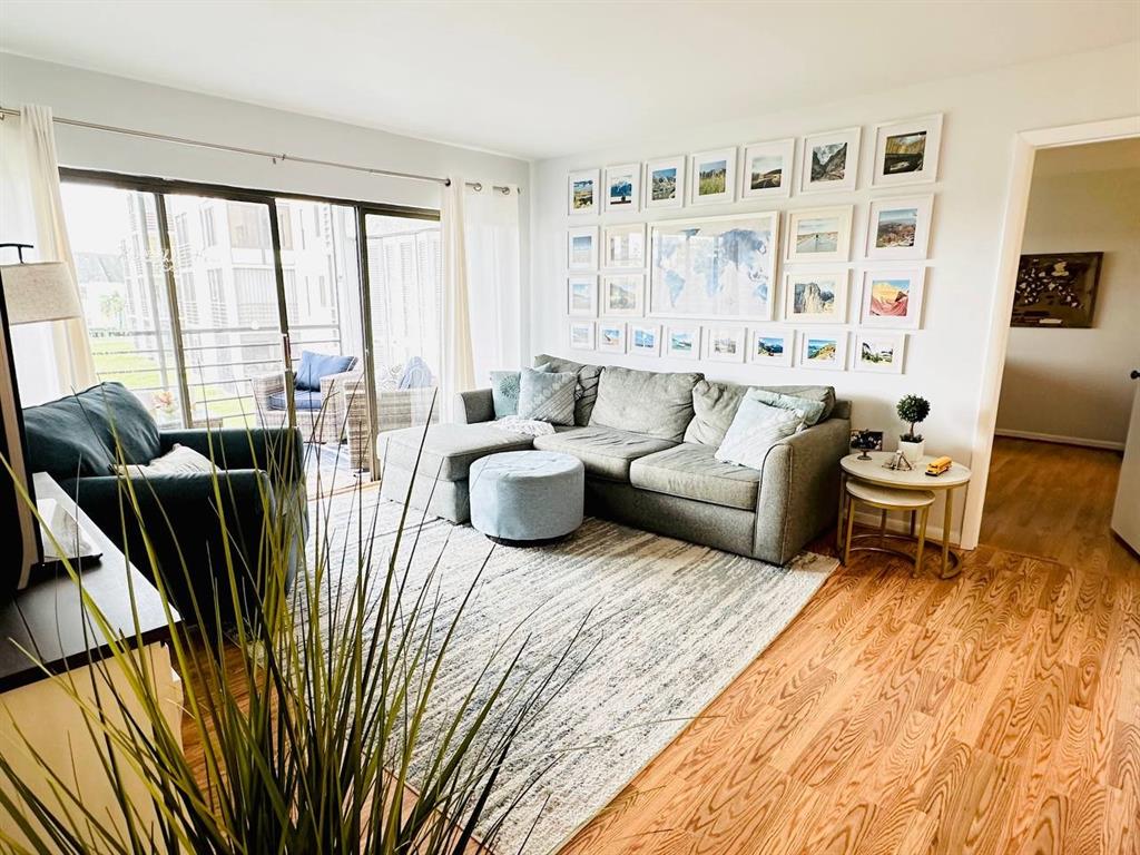 9300 Southwest 8th Street, Unit 214 Boca Raton, FL 33428 - Photo 4 of 32 a living room with furniture and a large window