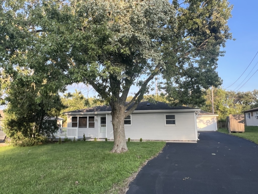 26835 South Linden Lane Crete, IL 60417 - Photo 28 of 31 a front view of a house with a garden and trees