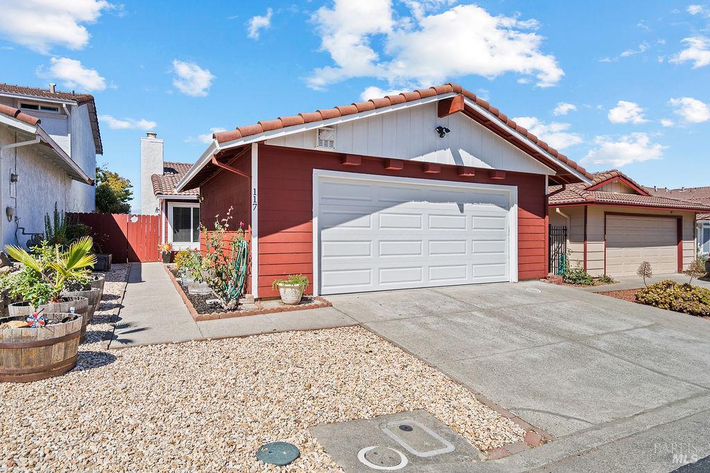 117 Dawson Place Vallejo, CA 94591 - Photo 1 of 1 a front view of a house with a yard and garage