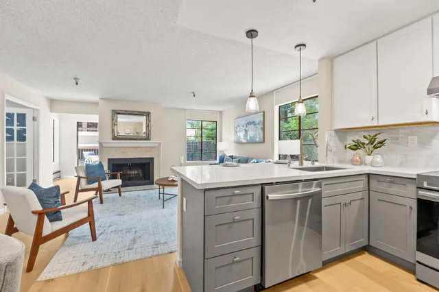 a kitchen with cabinets a sink and appliances