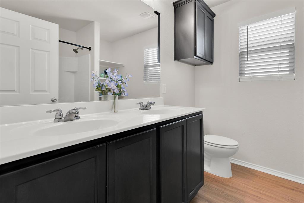 3011 Hickory Ridge Melissa, TX 75454 - Photo 22 of 30 Bathroom featuring a double vanity with dark cabinetry and white countertops