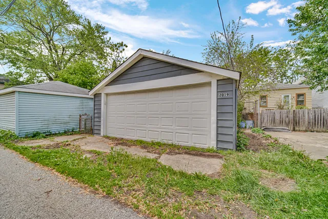 a front view of house with yard and trees