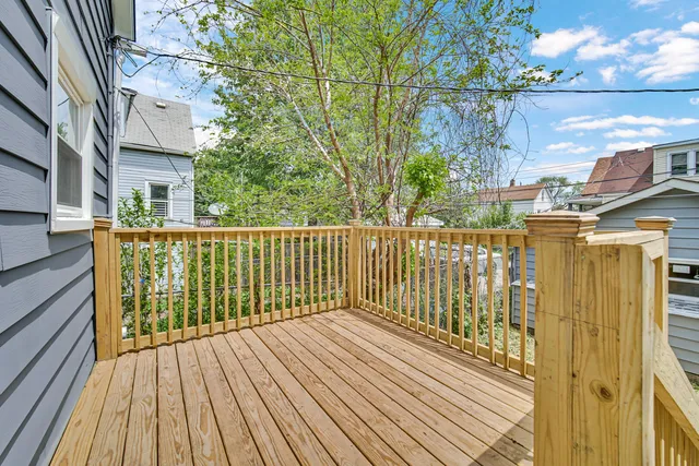 a view of a balcony with wooden floor