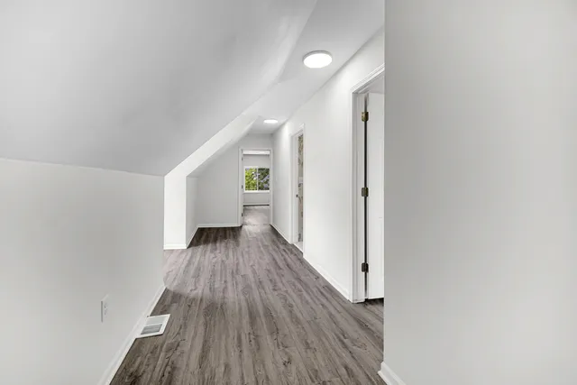 a view of wooden floor in an empty room