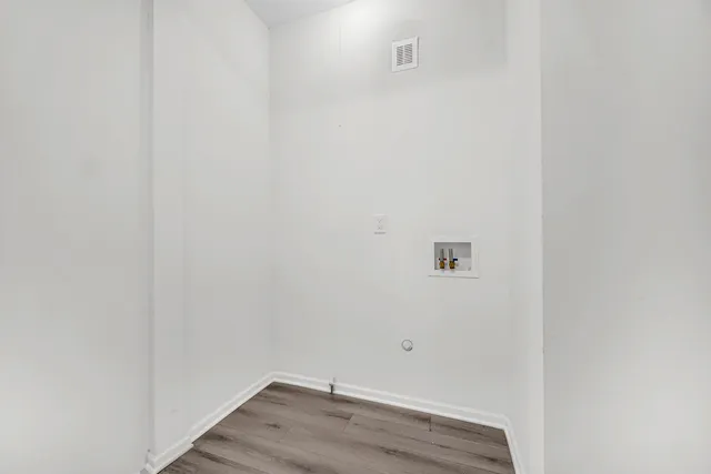 a view of small space with wooden floor