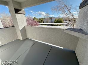 7255 West Sunset Road, Unit 2046 Las Vegas, NV 89113 - Photo 24 of 28 Unwind outdoors with a private balcony offering serene neighborhood vistas.