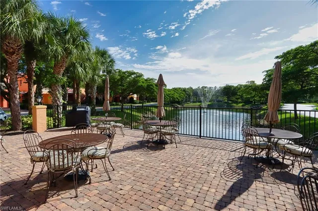 a view of a patio with a table and chairs
