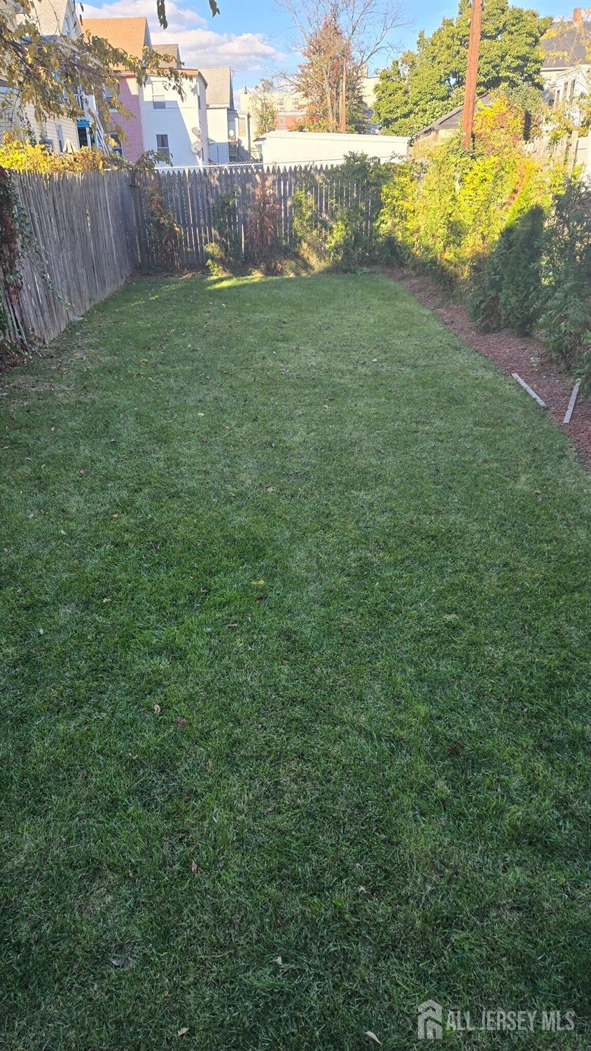 272 Market Street Perth Amboy, NJ 08861 - Photo 18 of 20 a view of a yard with an outdoor seating