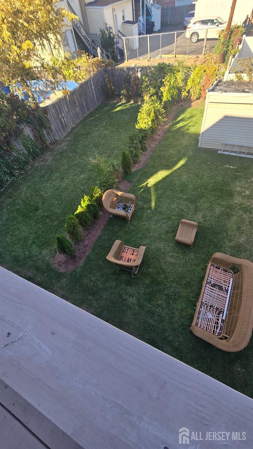 272 Market Street Perth Amboy, NJ 08861 - Photo 19 of 20 a view of a table and chairs in the garden