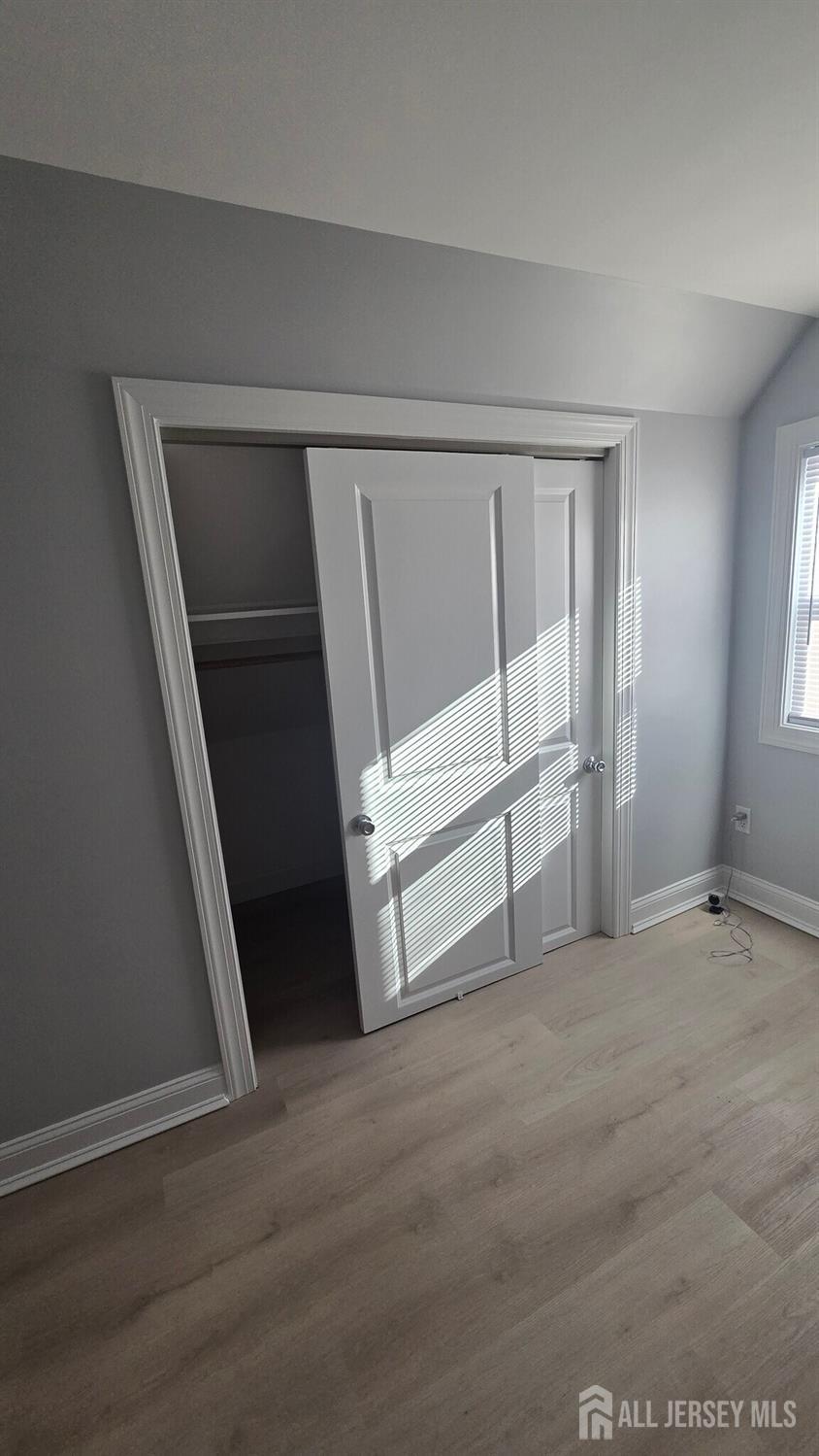 272 Market Street Perth Amboy, NJ 08861 - Photo 8 of 20 a view of an empty room with stairs and ventilation