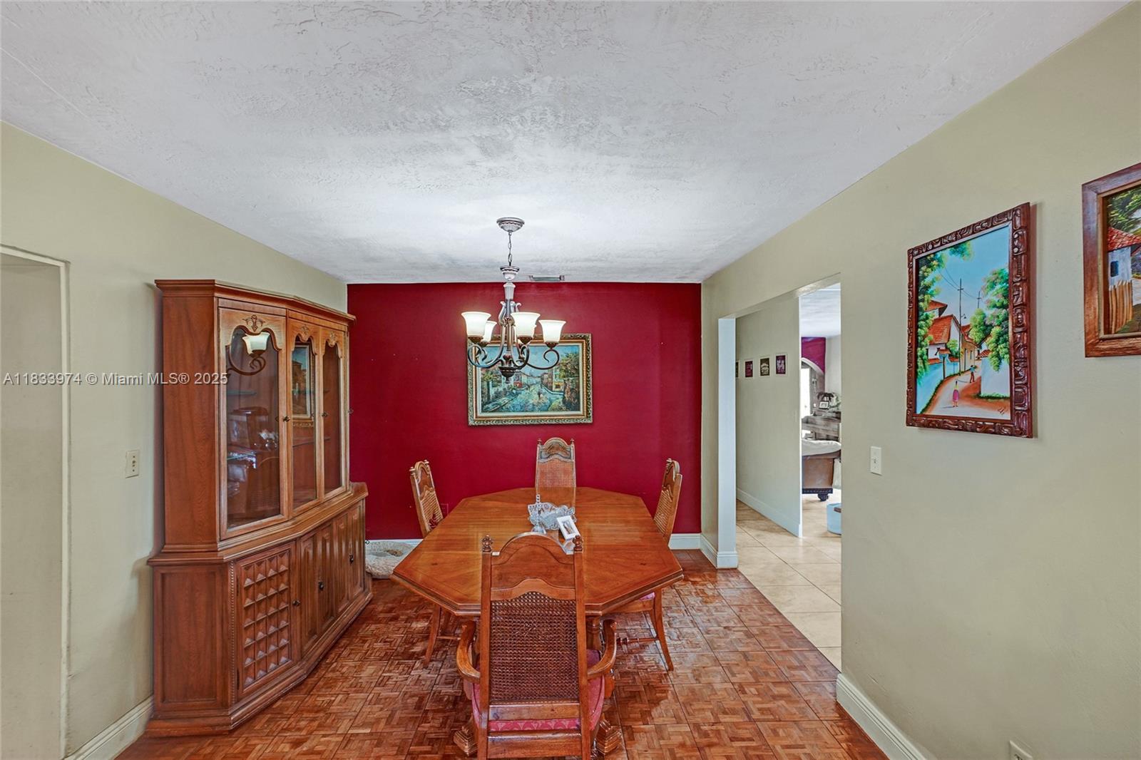 12763 Southwest 45th Terrace Miami, FL 33175 - Photo 11 of 30 a view of a dining room with furniture and chandelier