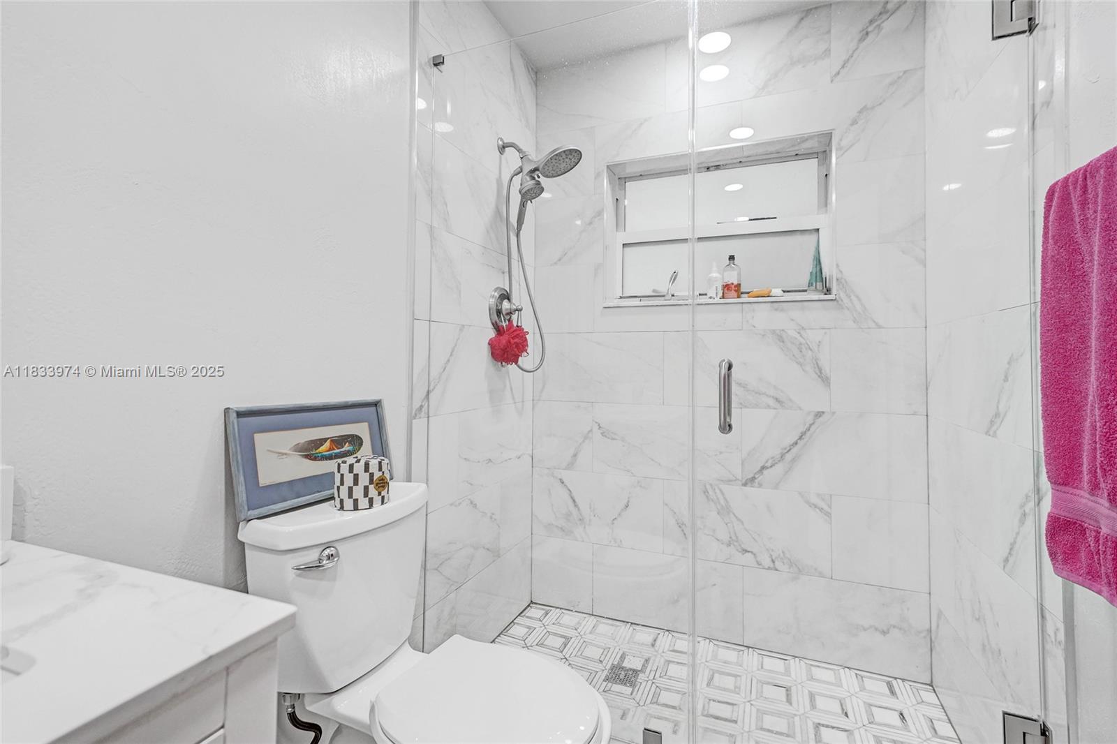 12763 Southwest 45th Terrace Miami, FL 33175 - Photo 14 of 30 a bathroom with a toilet sink and shower