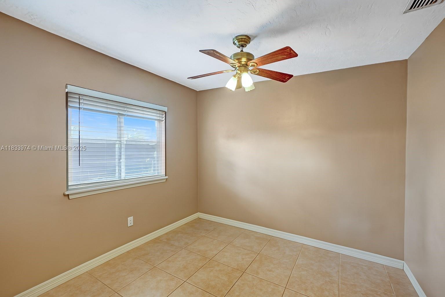 12763 Southwest 45th Terrace Miami, FL 33175 - Photo 16 of 30 an empty room with a window