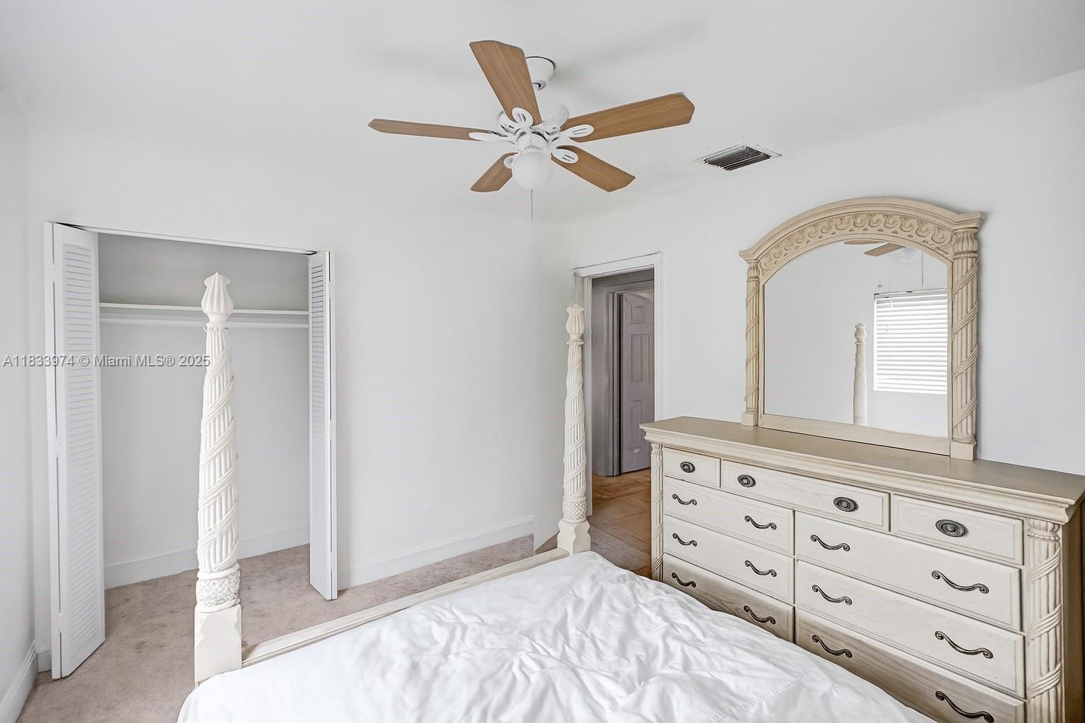 12763 Southwest 45th Terrace Miami, FL 33175 - Photo 17 of 30 a bedroom with a bed and a mirror