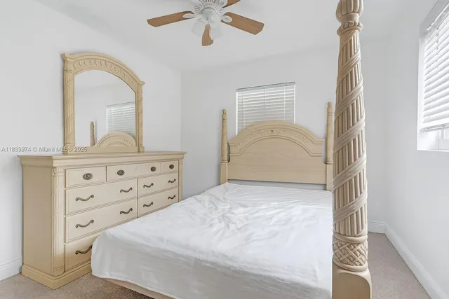 a bathroom with a sink mirror vanity and toilet