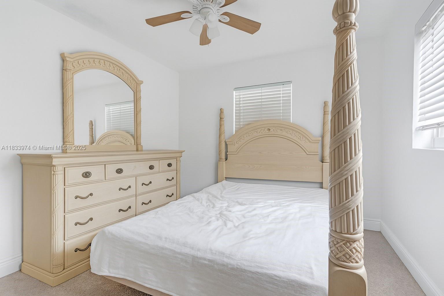 12763 Southwest 45th Terrace Miami, FL 33175 - Photo 18 of 30 a bedroom with a bed and a dresser