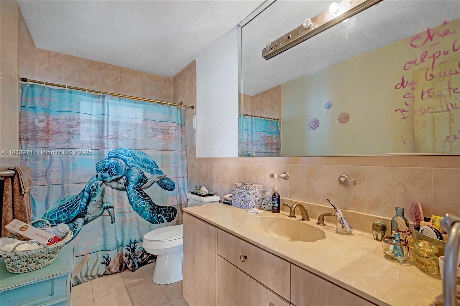 12763 Southwest 45th Terrace Miami, FL 33175 - Photo 19 of 30 a bathroom with a sink mirror vanity and toilet