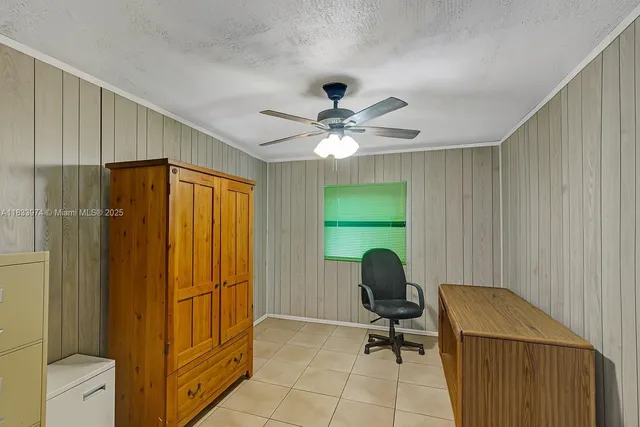 a room that has a bed and a television