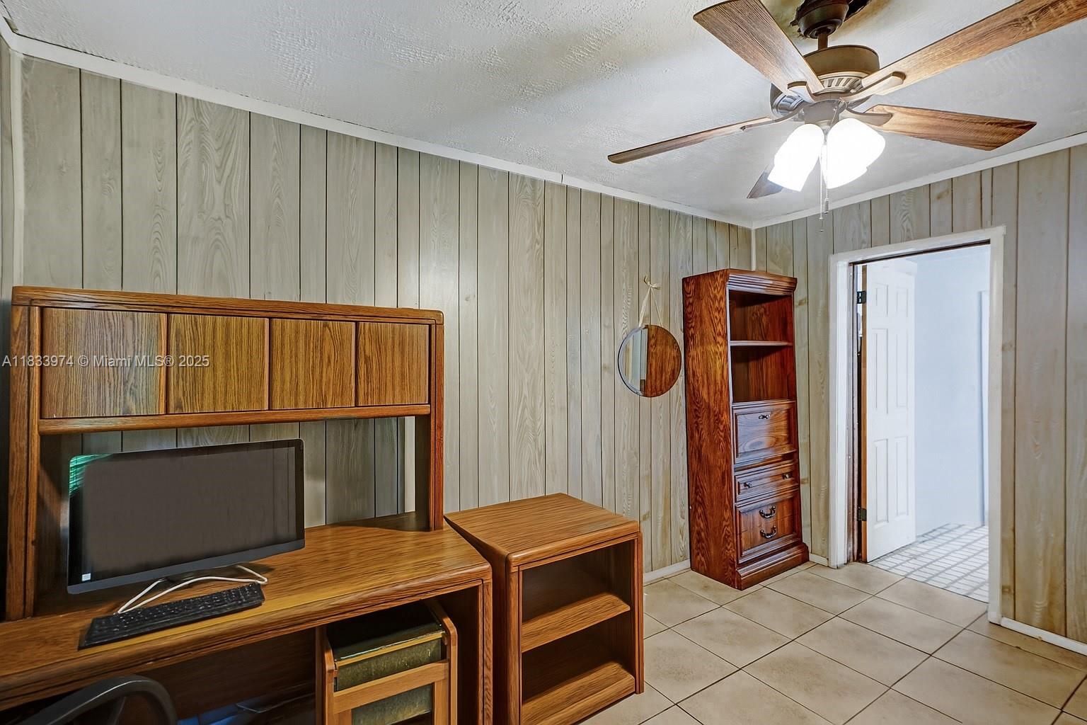 12763 Southwest 45th Terrace Miami, FL 33175 - Photo 23 of 30 a room that has a bed and a television