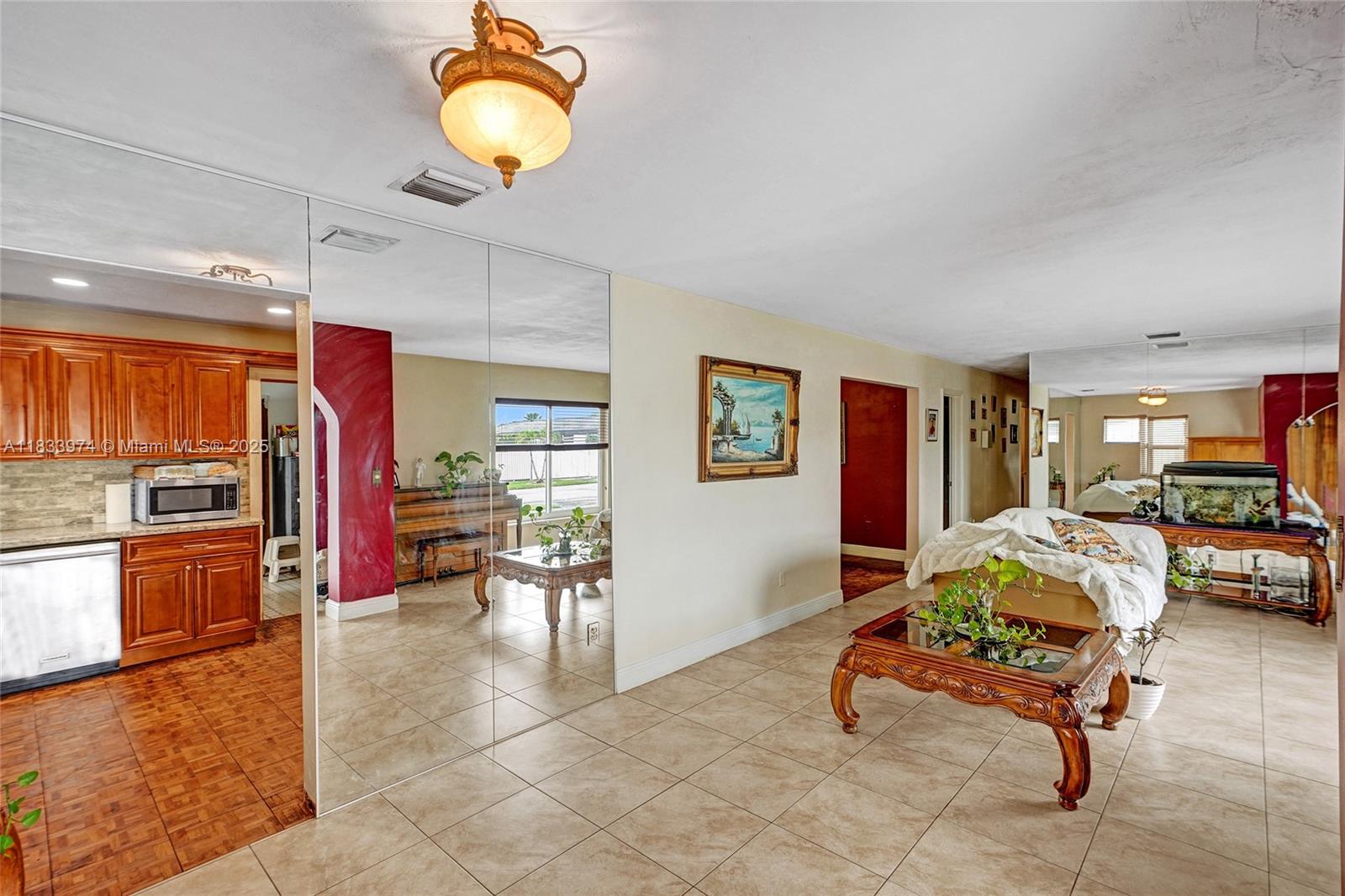 12763 Southwest 45th Terrace Miami, FL 33175 - Photo 3 of 30 a living room with furniture and a flat screen tv