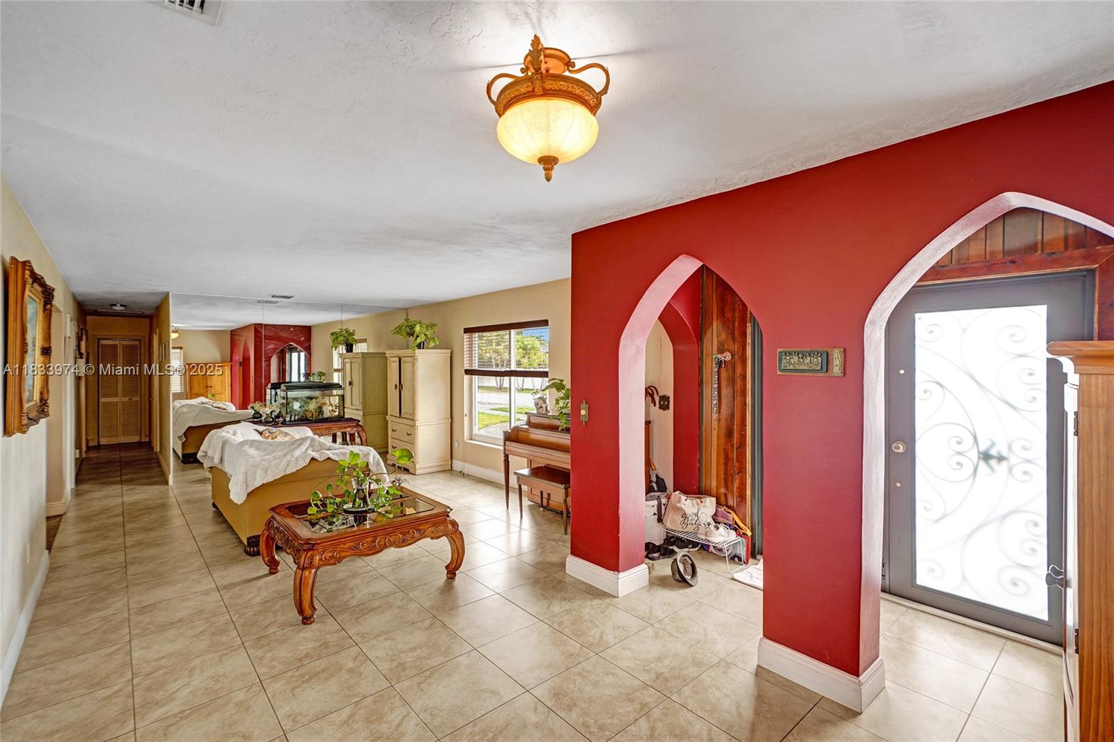12763 Southwest 45th Terrace Miami, FL 33175 - Photo 4 of 30 a living room with furniture and a large window