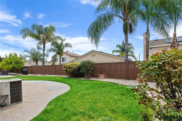 a view of a yard with palm trees