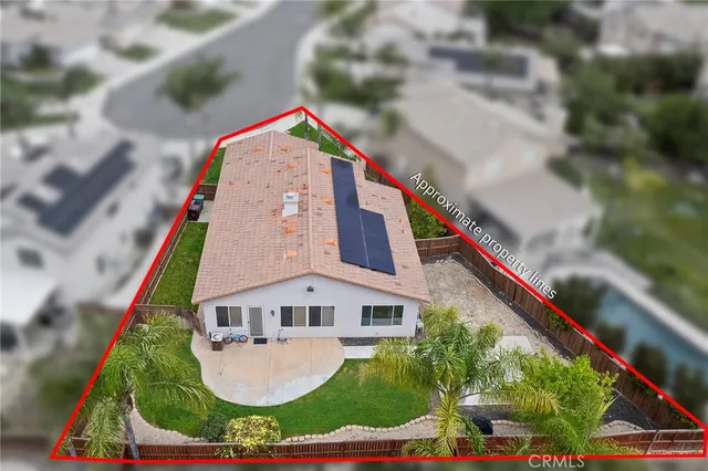 a view of building with yard and entertaining space