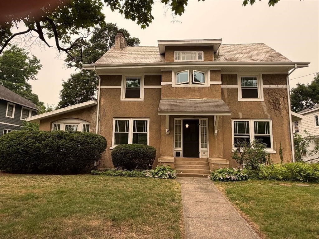 19 Wellesley Road Holyoke, MA 01040 - Photo 1 of 27 a front view of a house with a garden