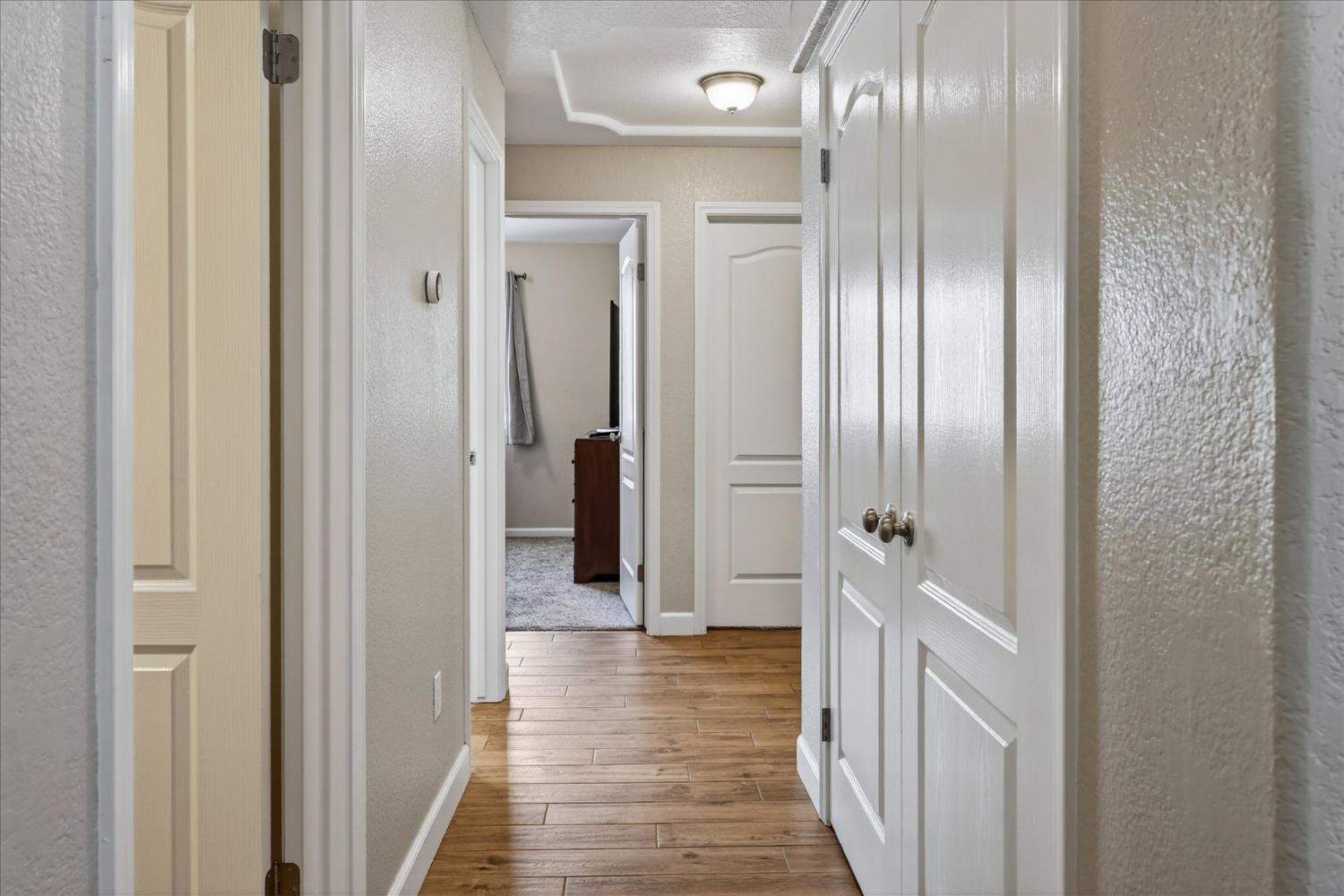 47482 Veater Ranch Road Coarsegold, CA 93614 - Photo 23 of 51 a view of a hallway with wooden floor